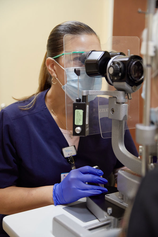 Each slit lamp biomicroscope at NYEE is equipped with a large plastic breath shield, which serves as a barrier between the examiner and patient.