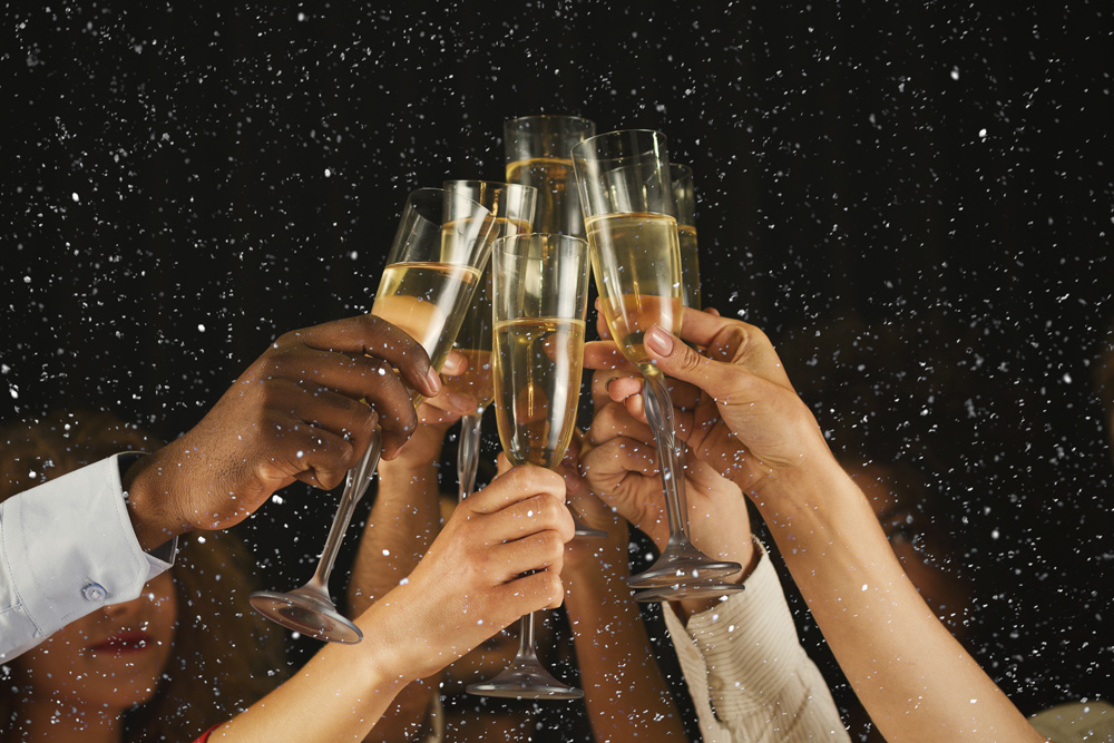 People celebrating with champagne glasses