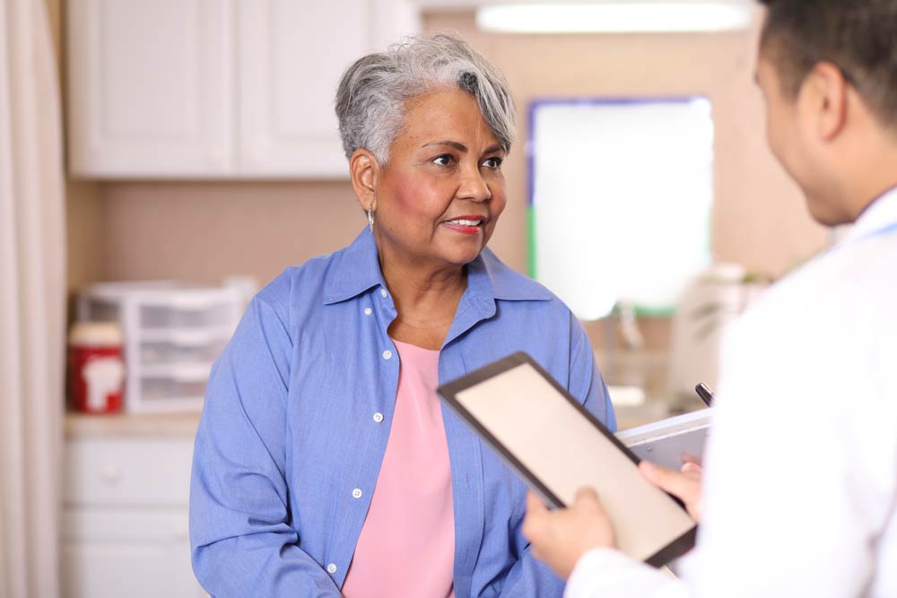 Doctor speaking to an older female patient